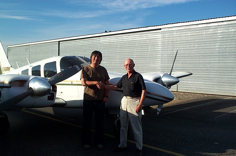 Shigo Hotta with Pilot Examiner Donn Richardson after the successful completion of Shigo's Mulit-engine Class Rating Flight Test.  Langley Flying School.